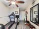 Home exercise room featuring a treadmill, rowing machine, weights, and a full-length mirror at 7273 Silverhorn Dr, Evergreen, CO 80439