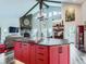 Open-concept living space featuring a bright kitchen with a large island that seamlessly connects to the living area at 7273 Silverhorn Dr, Evergreen, CO 80439