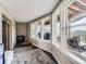 Enclosed sun room with multiple windows providing natural light and views of the outdoors at 7273 Silverhorn Dr, Evergreen, CO 80439