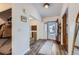 Bright and airy entryway with coat closet and bench at 14942 E Evans Ave, Aurora, CO 80014