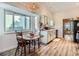 Charming kitchen breakfast nook with wood table and chairs at 14942 E Evans Ave, Aurora, CO 80014