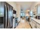 Modern kitchen with stainless steel appliances and open layout at 14942 E Evans Ave, Aurora, CO 80014