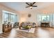 Spacious living room with hardwood floors and ample natural light at 14942 E Evans Ave, Aurora, CO 80014