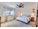 Large main bedroom with king-size bed and ceiling fan at 14942 E Evans Ave, Aurora, CO 80014