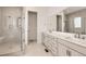 Contemporary bathroom with glass-enclosed shower, dual sinks and bright white color scheme at 3166 Newfound Lake Rd, Berthoud, CO 80513
