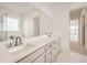 Bathroom with dual sinks, large mirror, and modern design at 3166 Newfound Lake Rd, Berthoud, CO 80513