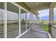 Spacious deck featuring a large sliding glass door, stone support columns, and scenic views at 3166 Newfound Lake Rd, Berthoud, CO 80513