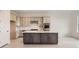 Modern kitchen featuring stainless appliances, a spacious island, and stylish cabinetry at 3166 Newfound Lake Rd, Berthoud, CO 80513