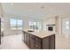 Contemporary kitchen with island and stainless steel appliances at 3166 Newfound Lake Rd, Berthoud, CO 80513