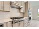 Modern kitchen with stainless steel appliances, custom cabinets, and herringbone backsplash at 3166 Newfound Lake Rd, Berthoud, CO 80513