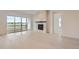 Bright and spacious living room with modern fireplace and light hardwood floors at 3166 Newfound Lake Rd, Berthoud, CO 80513