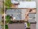 An aerial view showcases the home's layout, patio, solar panels and landscaping at 1518-1520 S Sherman St, Denver, CO 80210