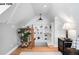 Cozy attic space with built-in shelving, hardwood floors, and a unique and bright open area at 1518-1520 S Sherman St, Denver, CO 80210
