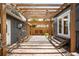 Charming backyard patio with brick pavers, a wooden pergola, and a peaceful ambiance for outdoor enjoyment at 1518-1520 S Sherman St, Denver, CO 80210
