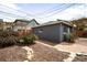 A charming backyard featuring a stone and brick path and mature landscaping at 1518-1520 S Sherman St, Denver, CO 80210