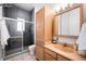 Bathroom featuring a glass-enclosed shower, a light wood vanity, and a large mirror at 1518-1520 S Sherman St, Denver, CO 80210