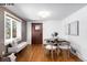 Cozy dining area features hardwood floors, a built-in bench, and natural lighting at 1518-1520 S Sherman St, Denver, CO 80210