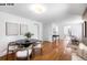 Bright dining room features hardwood floors, fresh paint, and a modern table set at 1518-1520 S Sherman St, Denver, CO 80210