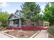 Charming side-by-side duplex with inviting front porch and professionally landscaped front yard at 1518-1520 S Sherman St, Denver, CO 80210