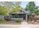 Charming single Gathering home with a covered front porch and a welcoming entryway at 1518-1520 S Sherman St, Denver, CO 80210