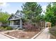 Charming single Gathering home with beautiful landscaping and a lovely front porch at 1518-1520 S Sherman St, Denver, CO 80210