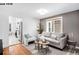 Comfortable living room features fresh paint, hardwood floors, and neutral decor at 1518-1520 S Sherman St, Denver, CO 80210