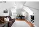Bright living room featuring a comfortable couch, desk, and shelving, all accented by natural light at 1518-1520 S Sherman St, Denver, CO 80210