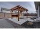 A backyard boasting a pergola with a bar and outdoor seating at 2785 Black Hawk Pl, Brighton, CO 80601