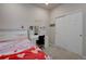 Cozy bedroom features carpet, closet and built-in vanity desk with storage at 2785 Black Hawk Pl, Brighton, CO 80601