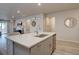 Spacious kitchen island featuring plenty of countertop space and sleek stainless steel appliances at 2785 Black Hawk Pl, Brighton, CO 80601