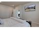 Bright main bedroom featuring carpet floors and a TV mounted on the wall at 2785 Black Hawk Pl, Brighton, CO 80601