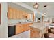 Entertainment space with wooden bar, mini-fridge, and granite countertops at 3311 Klondike Pl, Castle Rock, CO 80108