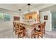 Finished basement bar area with stone accents and comfortable seating at 3311 Klondike Pl, Castle Rock, CO 80108