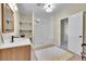 Bathroom featuring a glass-enclosed shower, modern vanity, and bright natural light at 3311 Klondike Pl, Castle Rock, CO 80108