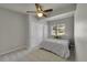 Neutral bedroom with a ceiling fan, window, carpet, and closet with paneled doors at 3311 Klondike Pl, Castle Rock, CO 80108