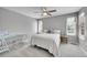 Bright bedroom with large windows, neutral decor, and comfortable furnishings at 3311 Klondike Pl, Castle Rock, CO 80108
