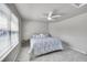 Inviting bedroom with soft colors, ceiling fan, and ample natural light at 3311 Klondike Pl, Castle Rock, CO 80108