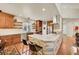Bright, updated kitchen features a stone breakfast bar, stainless steel appliances, and wood cabinets at 3311 Klondike Pl, Castle Rock, CO 80108