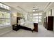 Serene main bedroom with tray ceilings, abundant natural light, and a peaceful ambiance at 3311 Klondike Pl, Castle Rock, CO 80108