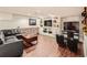 Entertainment area with a cozy sectional, built-in shelving, and a large screen TV at 325 S High St, Denver, CO 80209