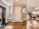 Welcoming entryway featuring hardwood floors, staircase, and a neutral color palette at 325 S High St, Denver, CO 80209