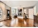 Comfortable living room with hardwood floors, a fireplace, a television, and plenty of natural light at 325 S High St, Denver, CO 80209