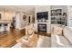 Living room with a fireplace, hardwood floors, and built-in shelves at 325 S High St, Denver, CO 80209