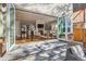 Open living area with fireplace and large doors leading to outdoor patio space at 325 S High St, Denver, CO 80209