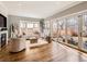 Bright living room boasts hardwood floors, neutral tones, and sliding glass doors to the backyard at 325 S High St, Denver, CO 80209