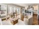 Bright living room boasts hardwood floors, neutral tones, and sliding glass doors to an outdoor patio at 325 S High St, Denver, CO 80209