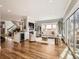 Open living room with hardwood floors, a fireplace, and ample natural light at 325 S High St, Denver, CO 80209