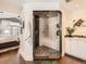 Modern shower room with glass enclosure, built-in bench, and stylish tile work, adjacent to the bedroom at 325 S High St, Denver, CO 80209