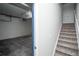 Basement access with stairs and garage entry at 6436 Silver Mesa Dr # E, Highlands Ranch, CO 80130