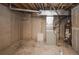 Unfinished basement with HVAC and water heater at 6436 Silver Mesa Dr # E, Highlands Ranch, CO 80130